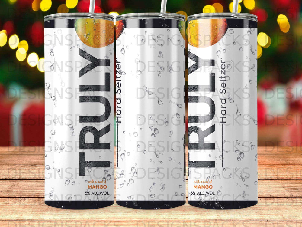 Three Truly Hard Seltzer Mango cans with condensation, on a wooden surface.