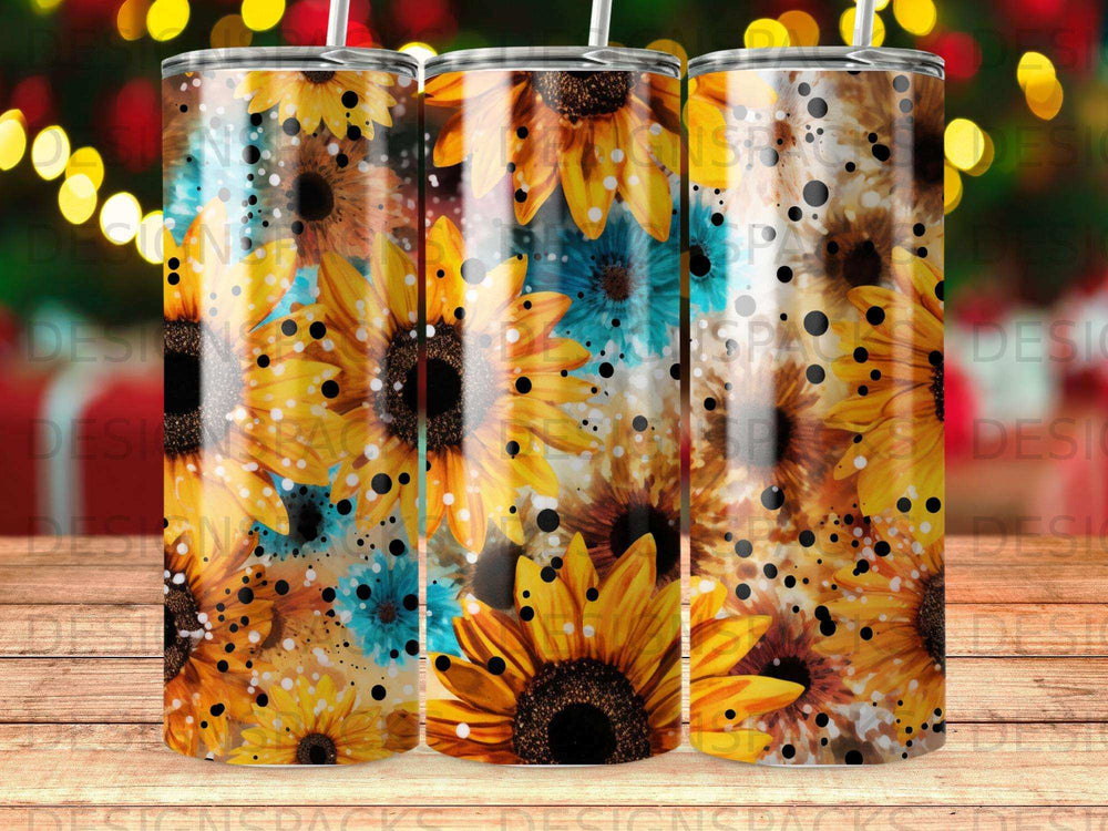 Three tumblers with a sunflower and blue floral pattern.