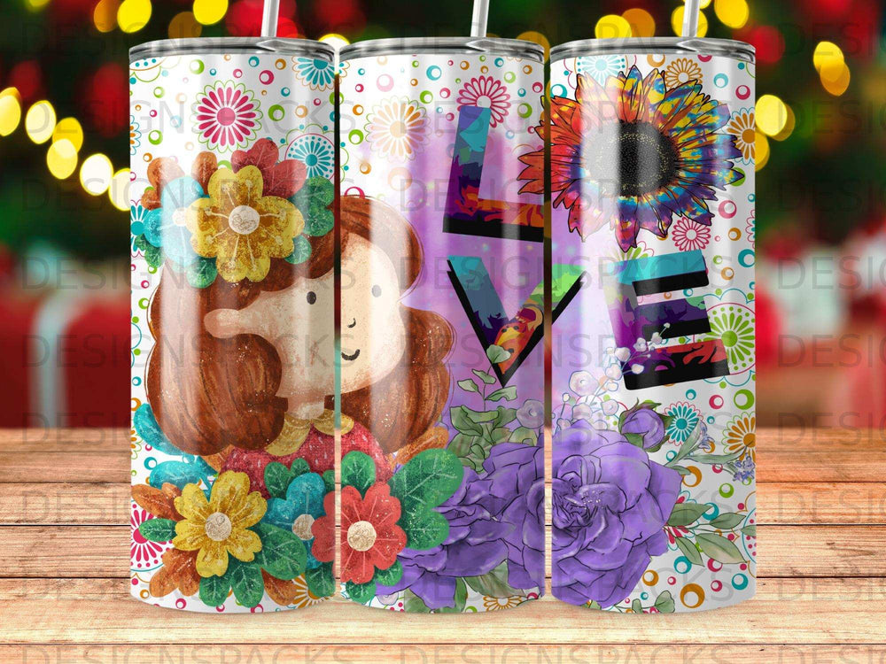 Tumbler with colorful flowers, a woman's face, and the word "LOVE".