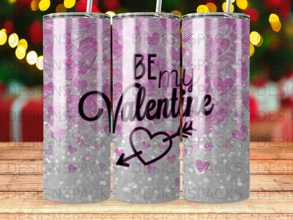 Pink heart pattern tumbler with "Be My Valentine" and arrow through heart.