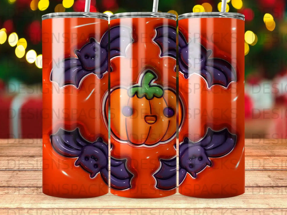 Orange pumpkin with bats and a colorful pattern on a tumbler.