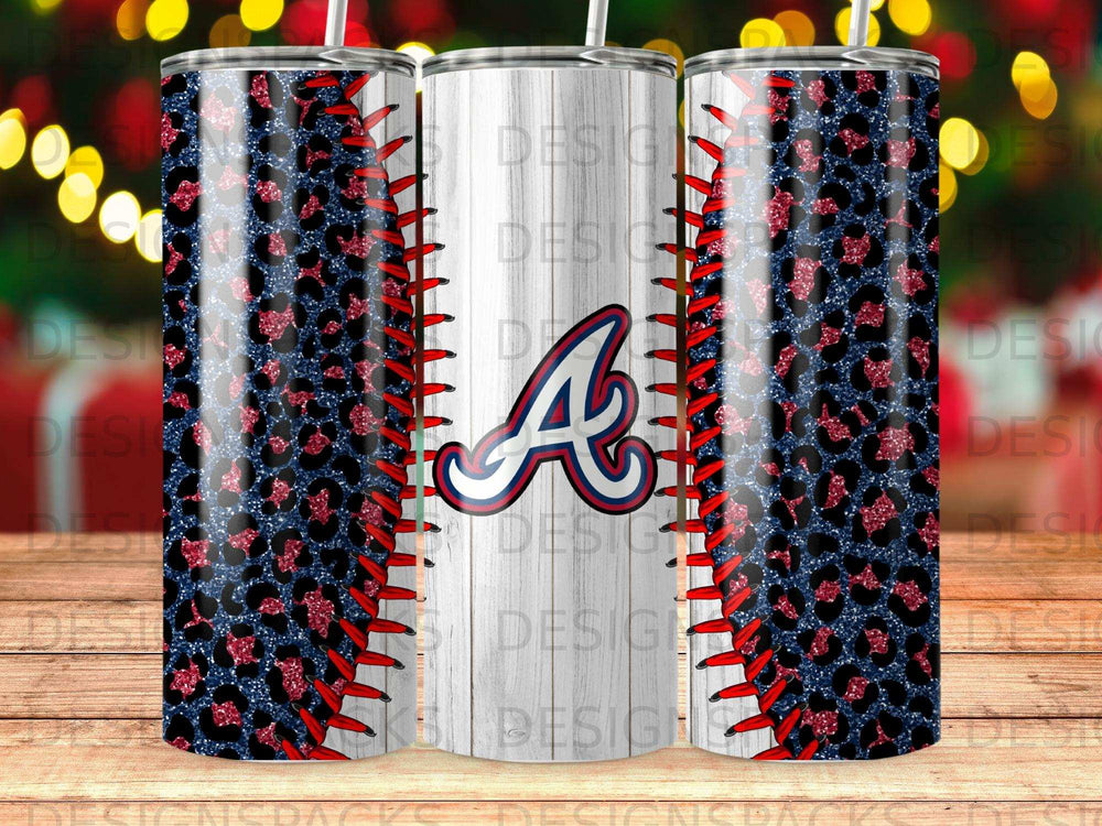 White tumbler with blue and red baseball stitching and leopard print.