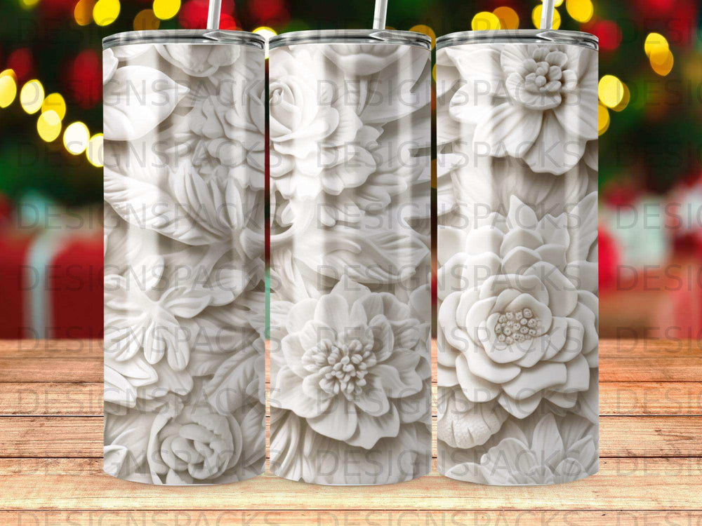 White embossed floral pattern on a tumbler with a wooden background.