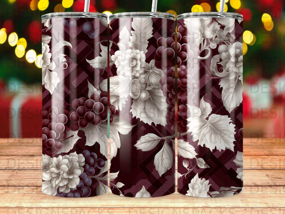 Burgundy tumbler with dark grapes, leaves, and white floral pattern.
