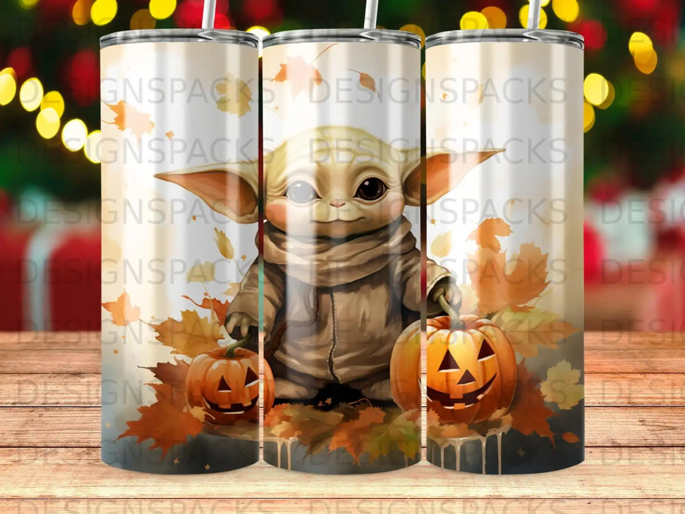 Grogu in a hooded jacket with pumpkins and autumn leaves.