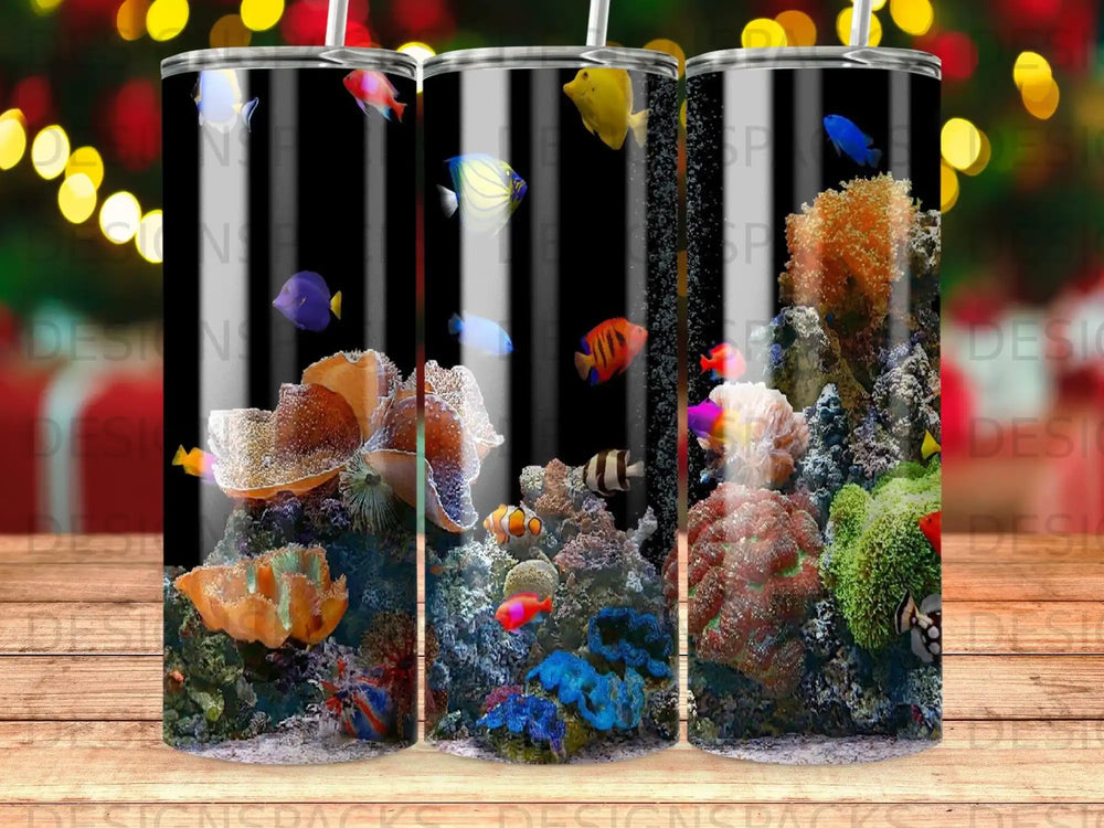 Tumbler with colorful coral reef and tropical fish on a black background.