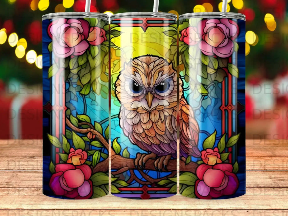 Stained glass owl with pink flowers and green border.