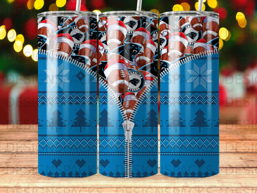 Carolina Panthers football helmets on a blue snowflake and Christmas tree pattern tumbler.
