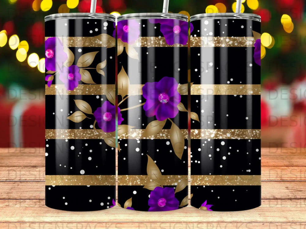 Floral tumbler with gold stripes and glitter accents on a dark background.
