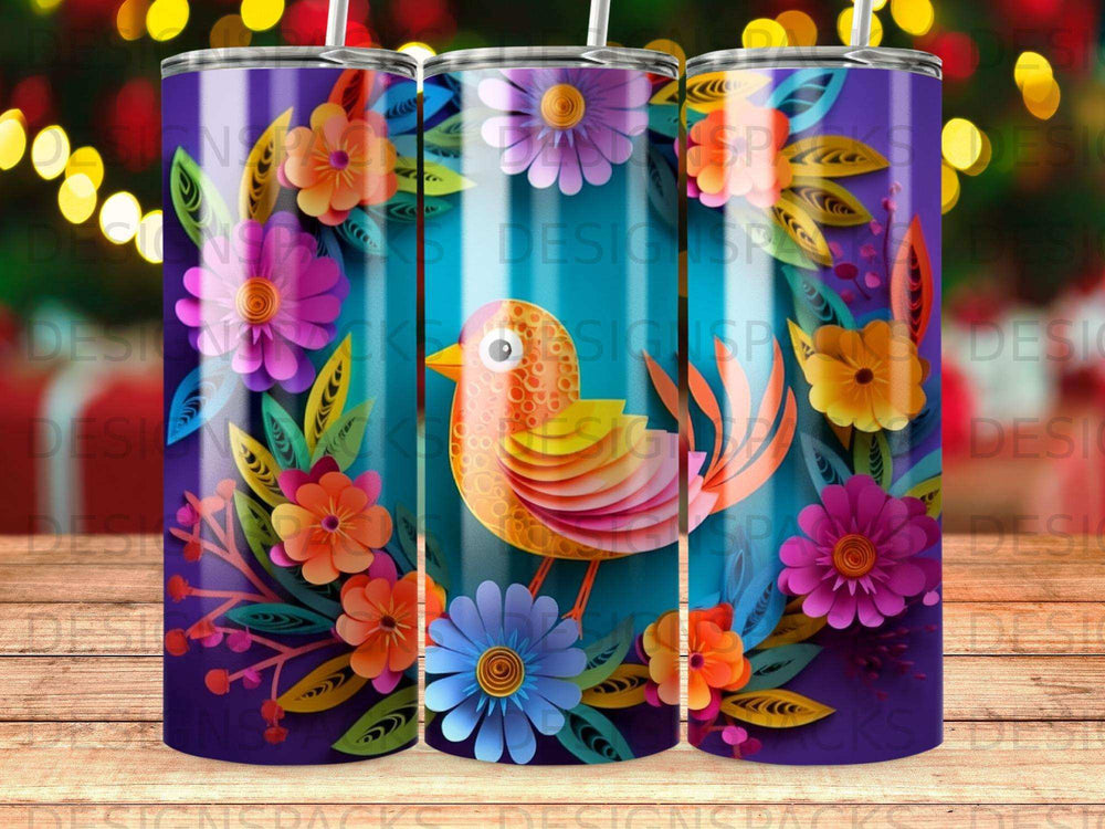 Orange bird surrounded by colorful floral designs on a skinny tumbler.