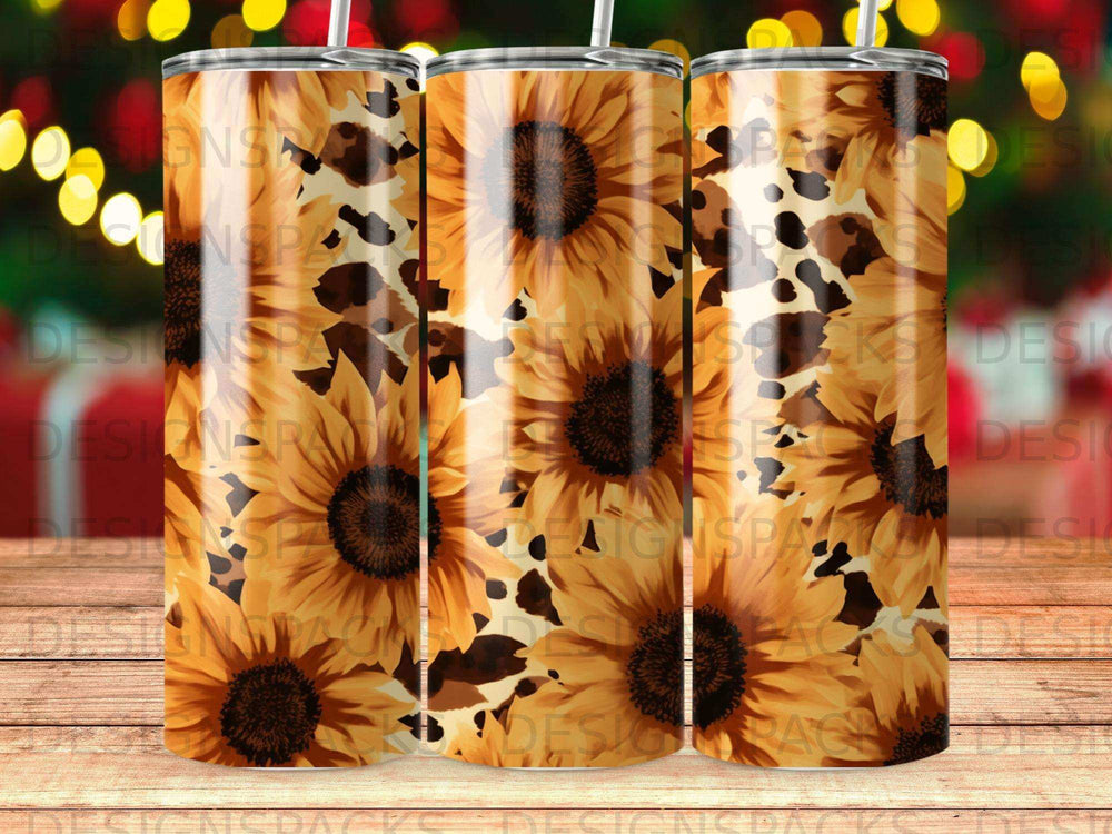 Tumbler with repeating pattern of sunflowers and cow print.
