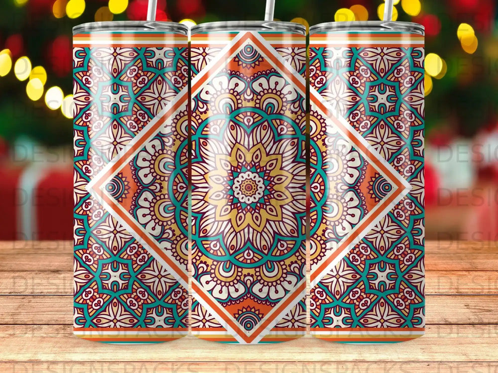 Three tall, colorful tumblers with a mandala pattern sit on a wooden surface.