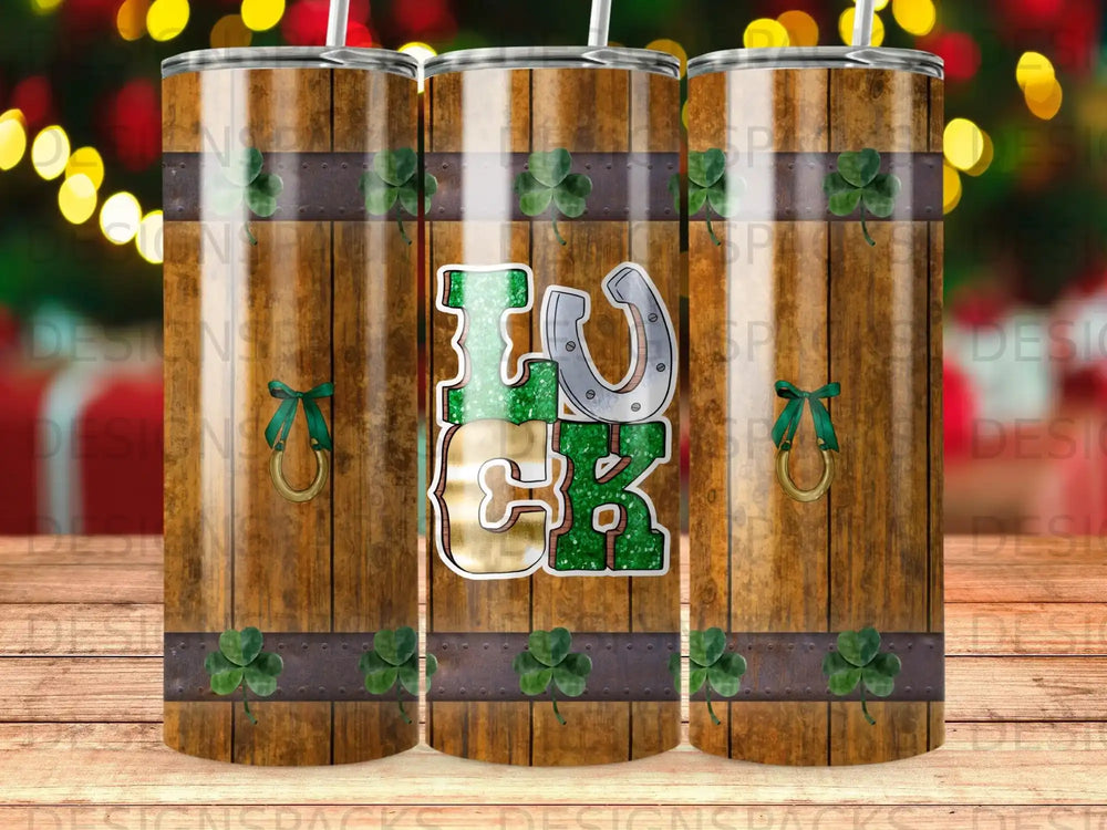 Lucky horseshoe and shamrock design on a wooden tumbler.