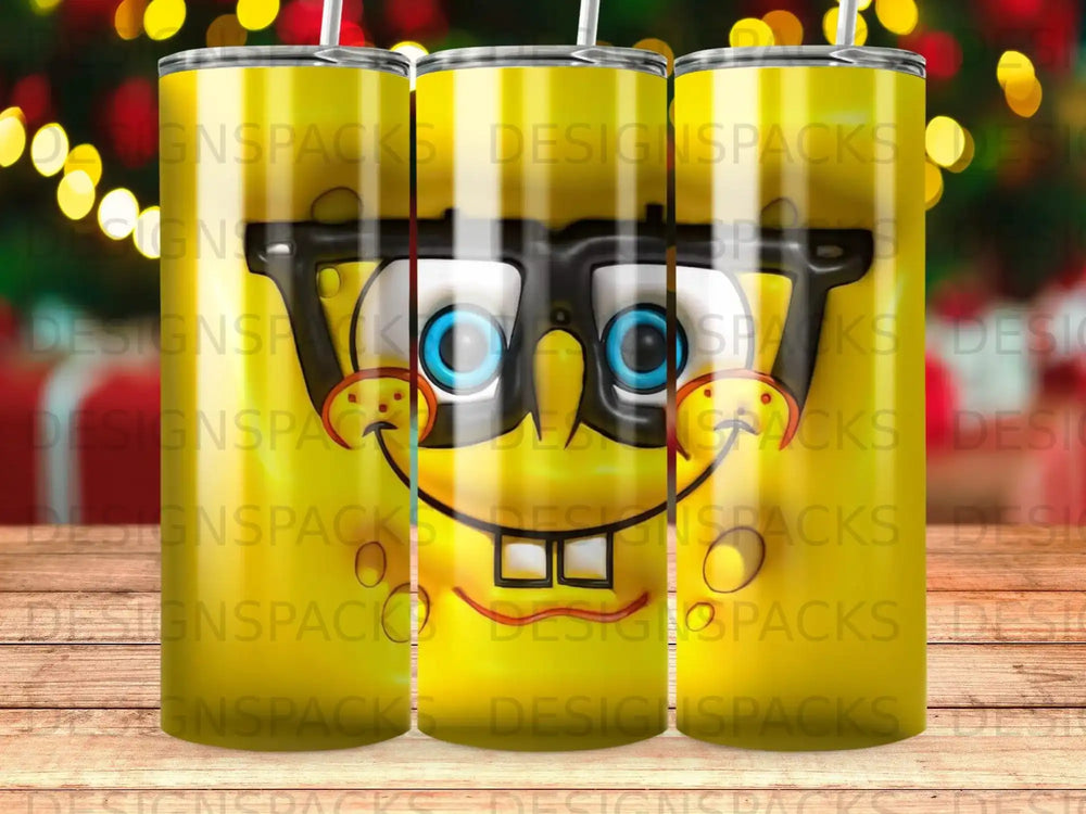 SpongeBob SquarePants character face on a yellow tumbler with repeated "DESIGNSPACKS" watermark.