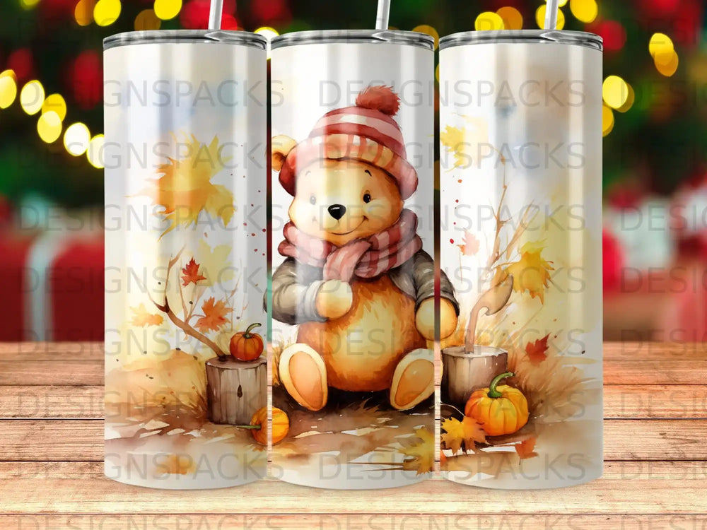 Winnie the Pooh in autumn outfit with pumpkins and leaves.