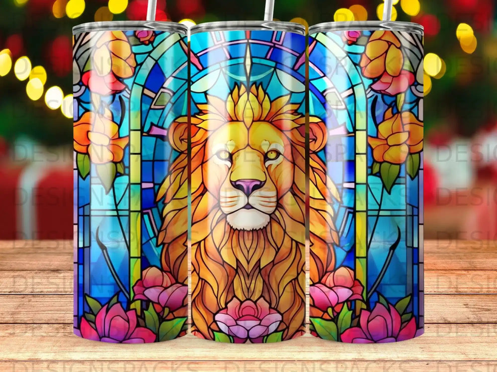 Lion's head design on a stained glass tumbler with flowers.