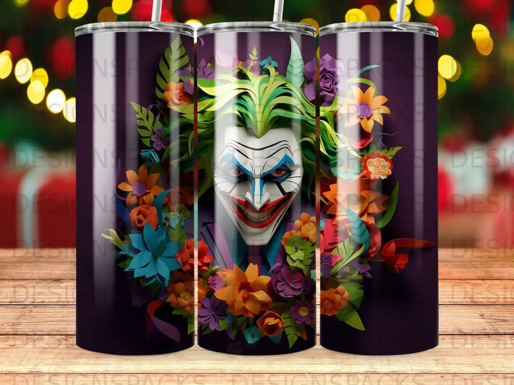 Joker face with green hair surrounded by colorful flowers on a dark purple tumbler.