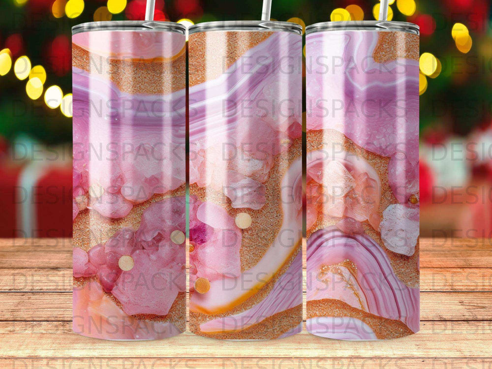 Tumbler with pink and gold marble and glitter design.