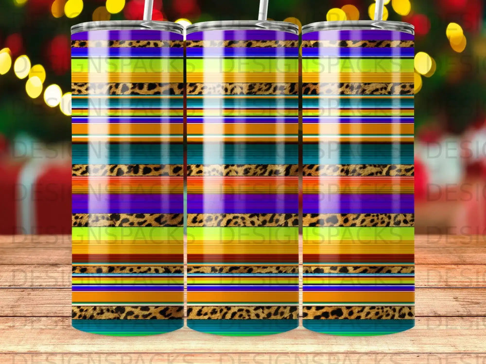 Three tumblers with colorful striped and leopard print patterns.