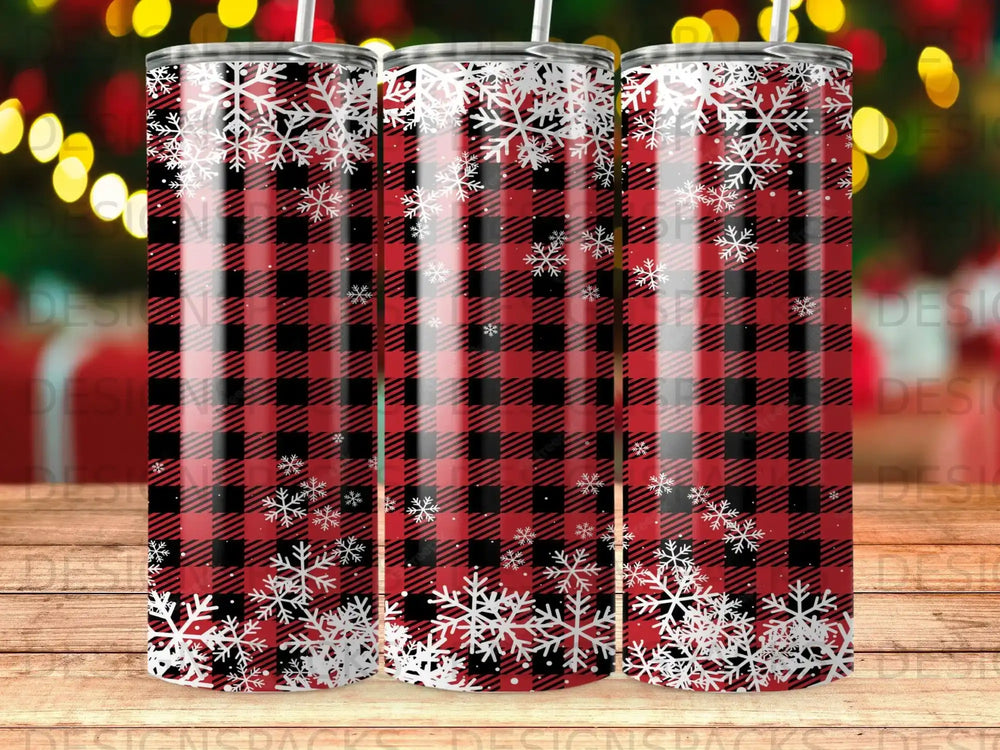 Red and black buffalo plaid tumbler with white snowflakes.
