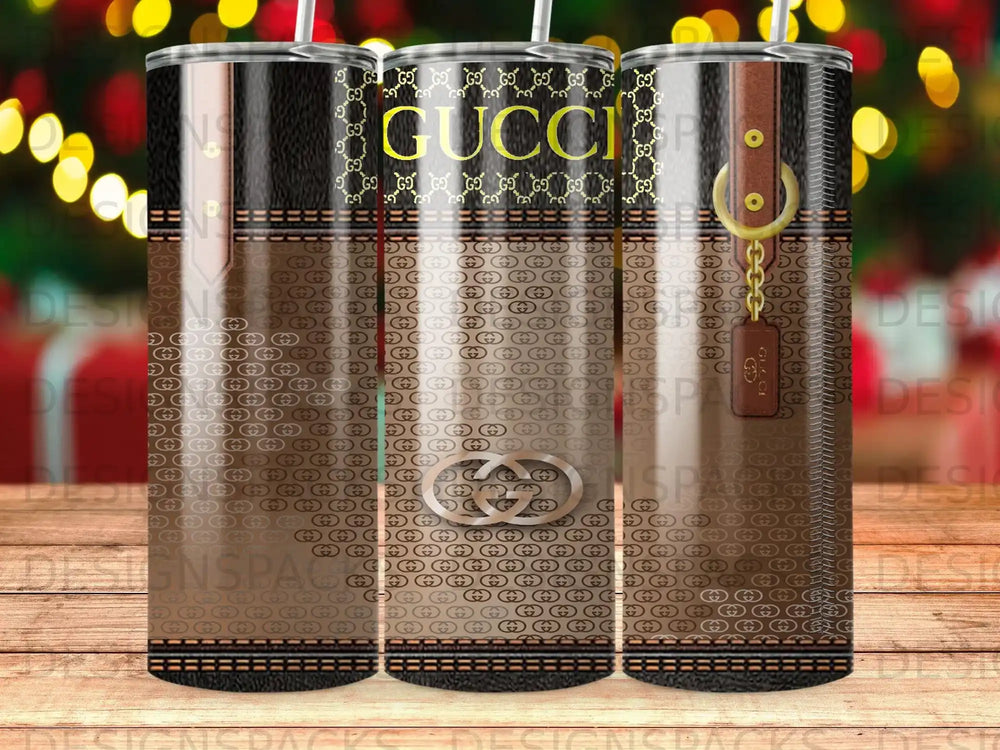 Gucci pattern tumbler with gold chain detail and buckle.