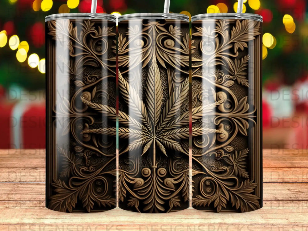 Gold ornate cannabis leaf design on a black textured tumbler.