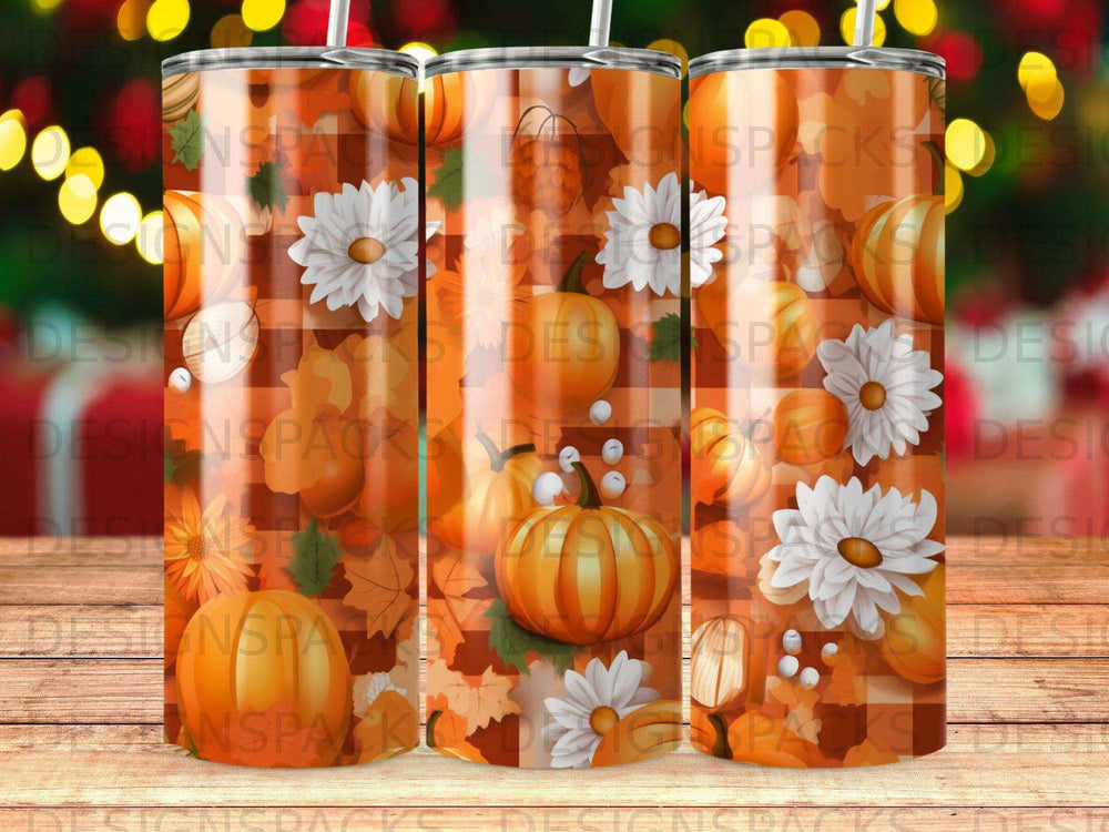 Autumn themed tumbler with pumpkins, flowers, and scattered leaves.