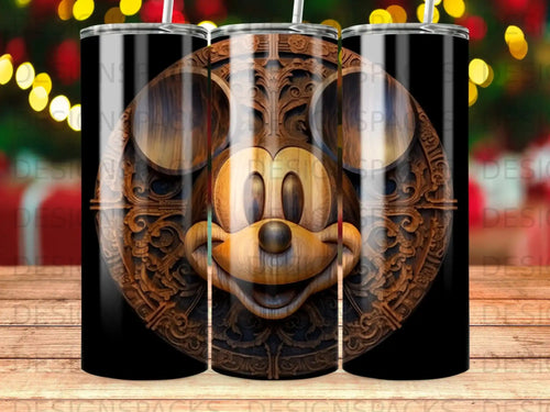 Mickey Mouse face carved into wood on a black tumbler.