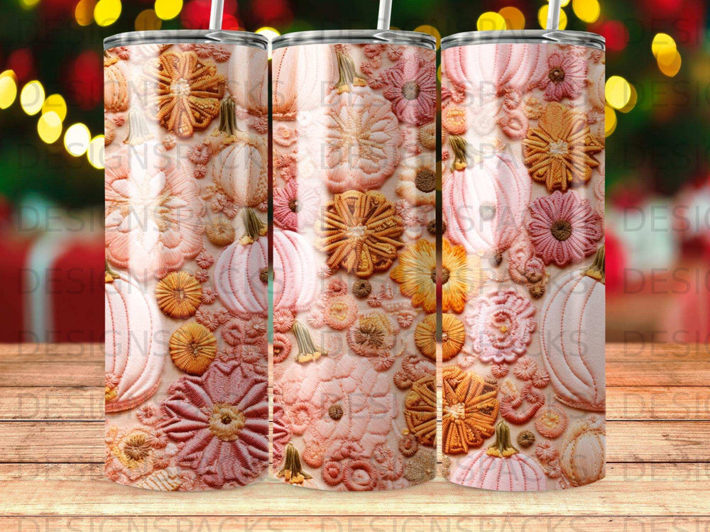 Textured pumpkins and flowers on a tumbler.