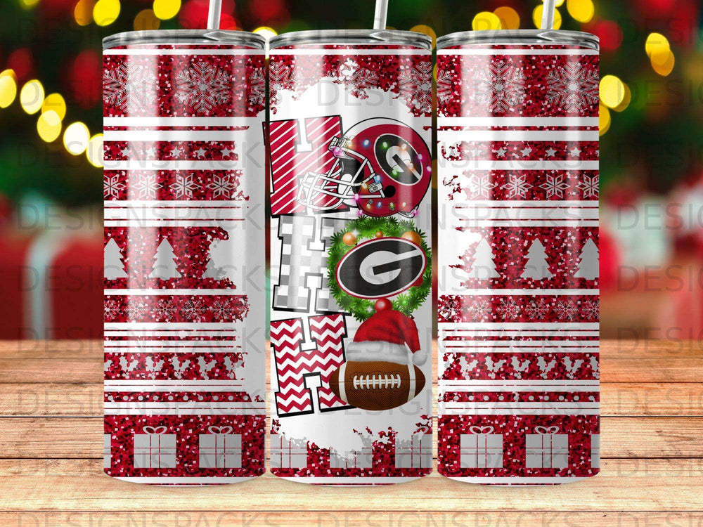 Christmas tumbler with HO HO HO text, snowflakes, red stripes, and football helmet.