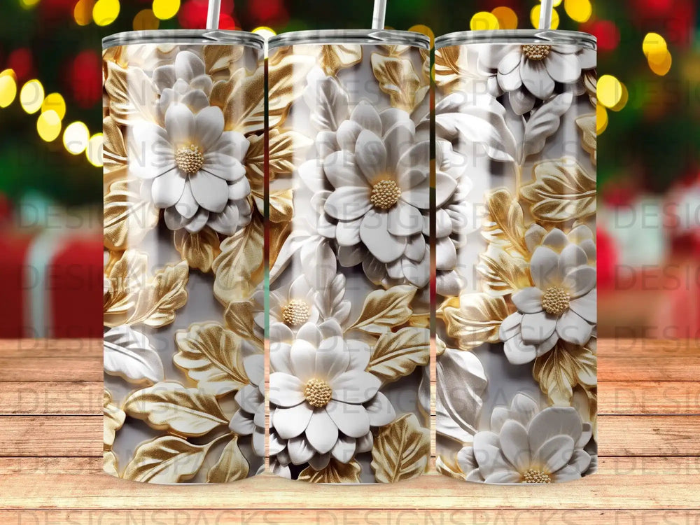 Three 3D embossed white floral and gold leaf tumblers against a bokeh background.