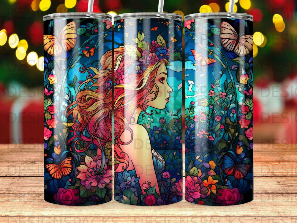 Tumbler with a colorful woman's profile adorned with flowers and butterflies.