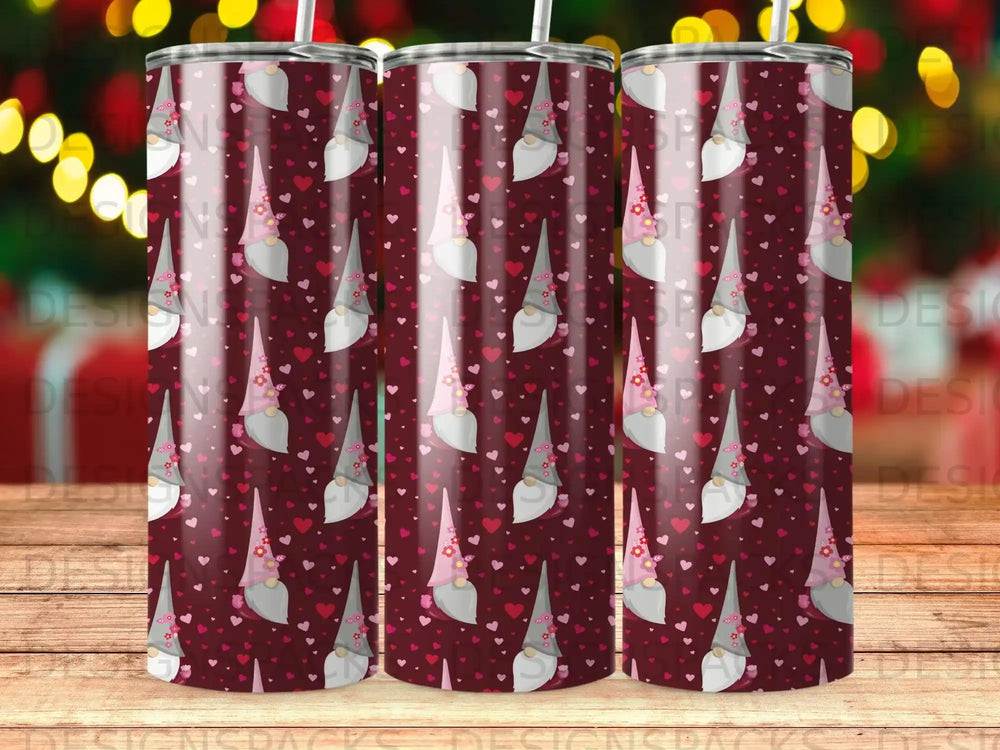 Pink and grey gnomes with hearts and flowers pattern on a tumbler.