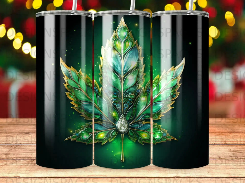 Green marijuana leaf design with gold accents on a black tumbler.