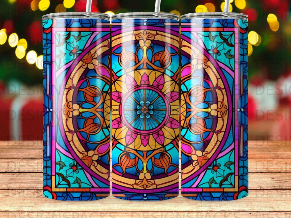 Stained glass pattern tumbler with circular floral design on wood surface.