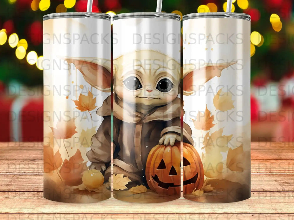 Grogu with a jack-o'-lantern and fall leaves on a tumbler.