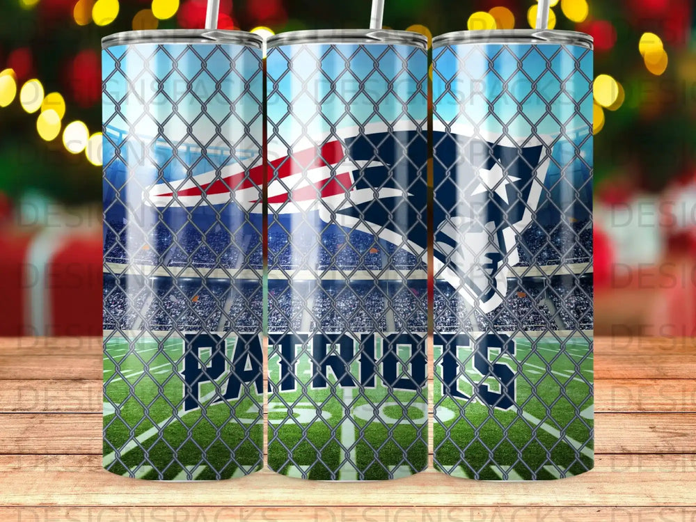 New England Patriots logo on stadium background seen through chain-link fence.