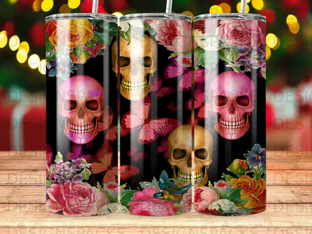 Floral skulls and butterflies on a black tumbler design.
