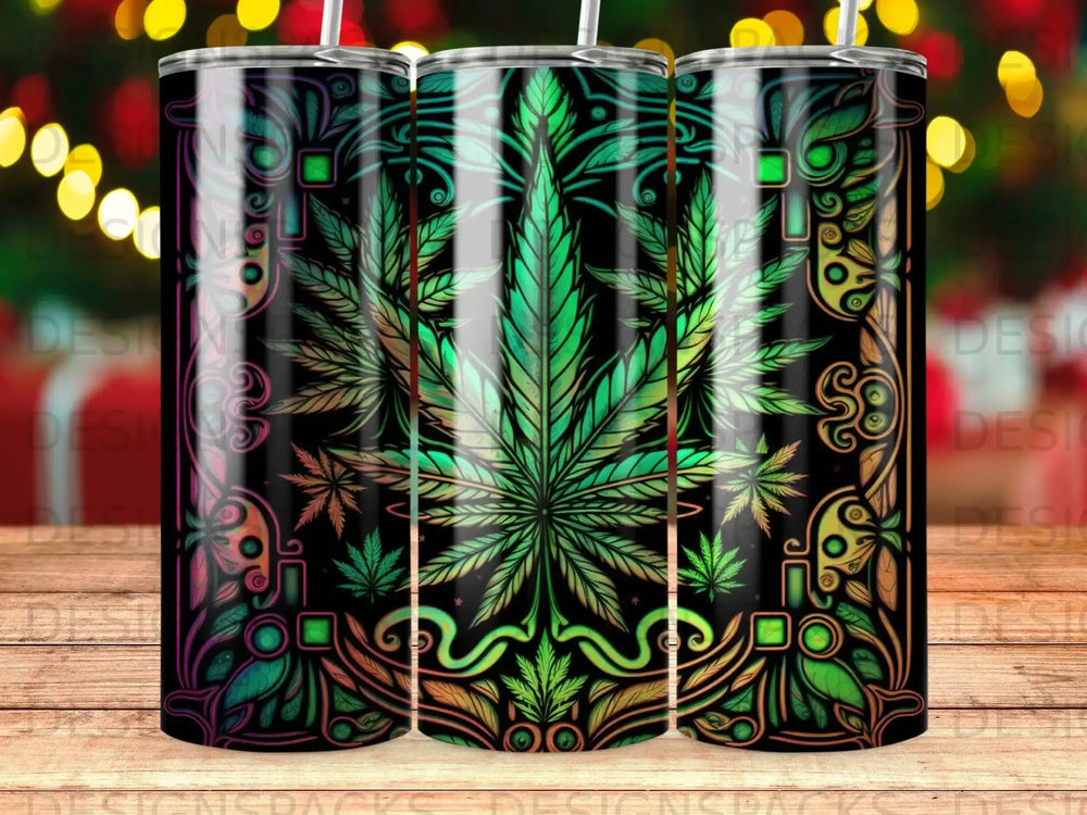 Green marijuana leaf design on a black tumbler with colorful ornate patterns.