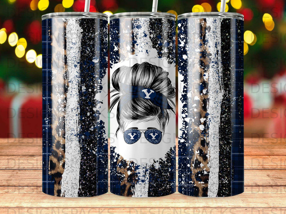 Tumbler with messy bun hair, sunglasses, and "Y" logo on striped and leopard print background.