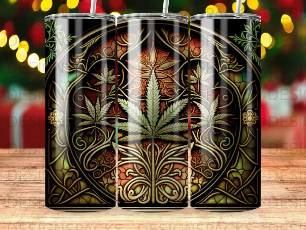 Stained glass tumbler with cannabis leaf motif and ornate gold detailing.