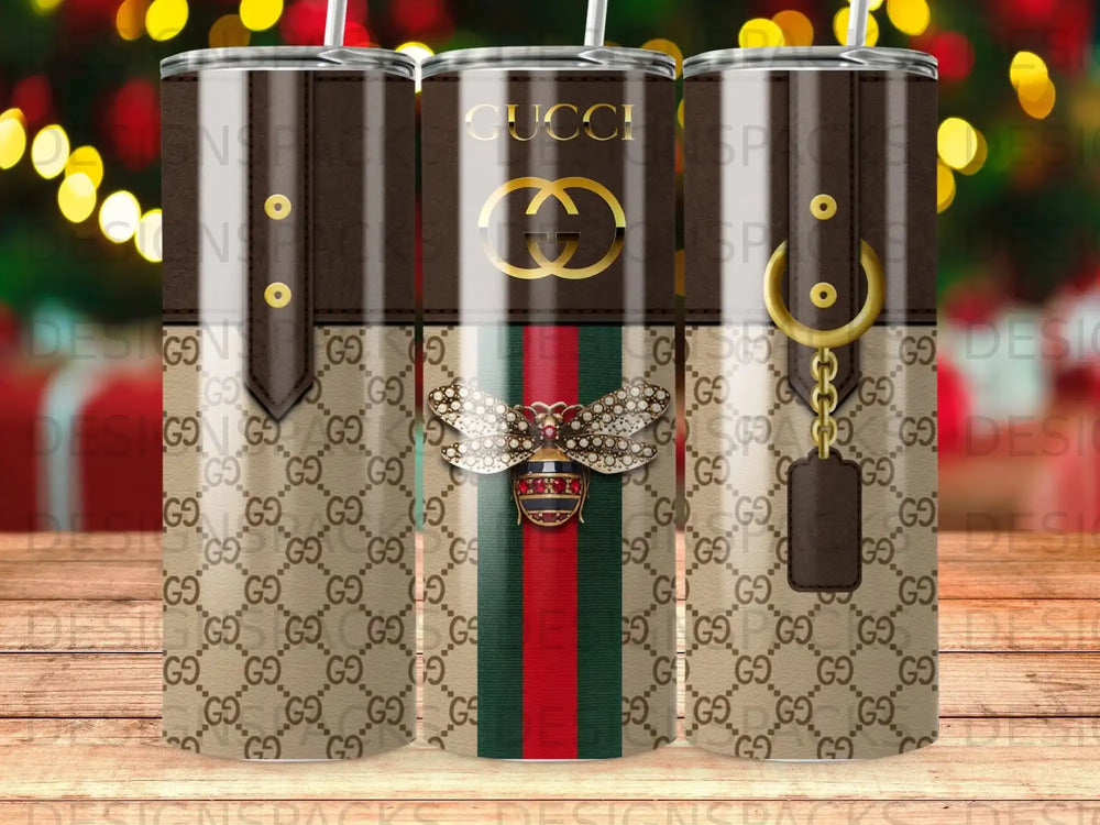 Gucci tumbler with bee design and brown GG logo pattern.
