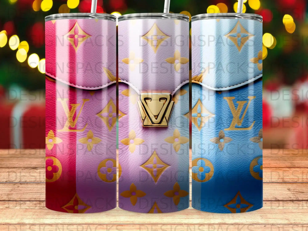 Three tumblers with Louis Vuitton-inspired pink, purple, and blue patterns.