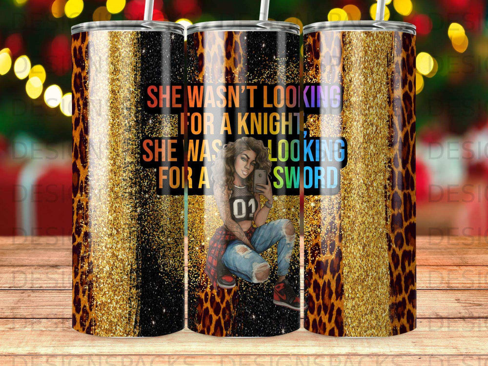 Tumbler with "She wasn't looking for a knight, she was looking for a sword" text.