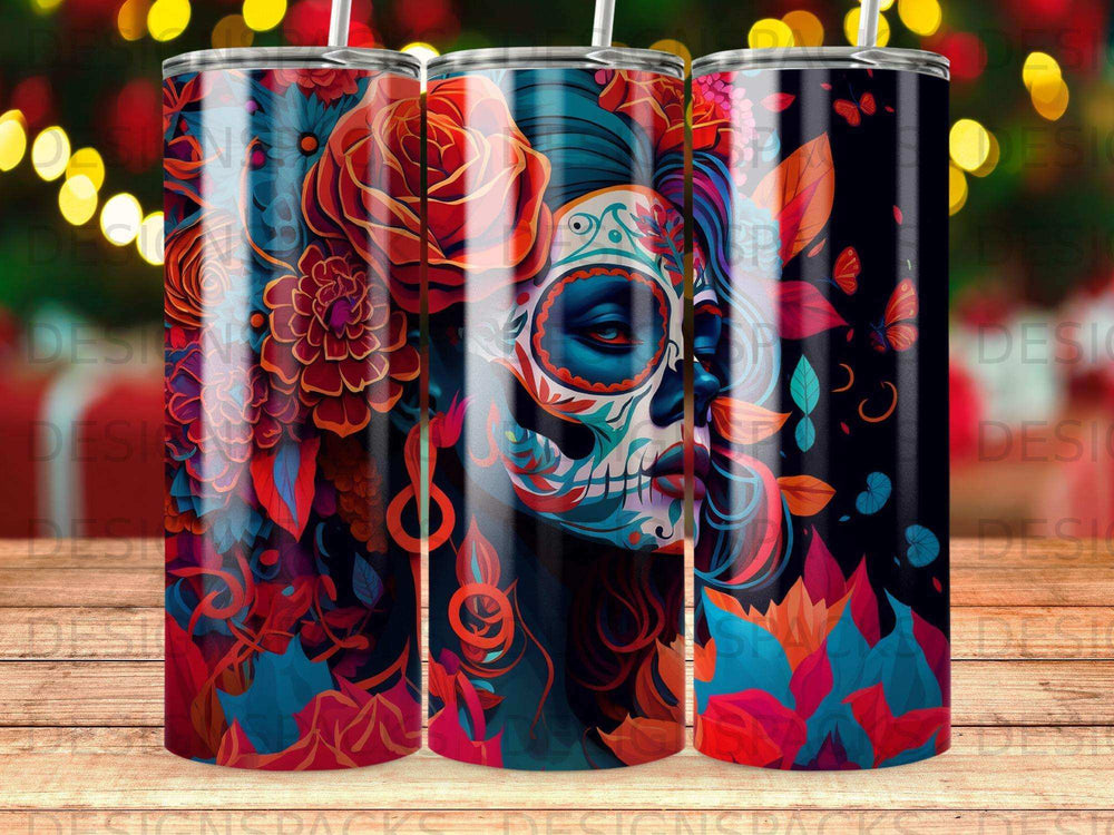 Day of the Dead skull and floral art on a dark tumbler.