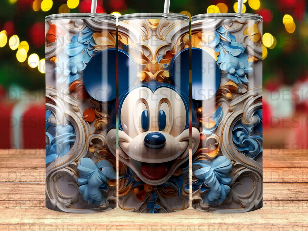 Mickey Mouse face with ornate gold and blue floral accents on a tumbler.