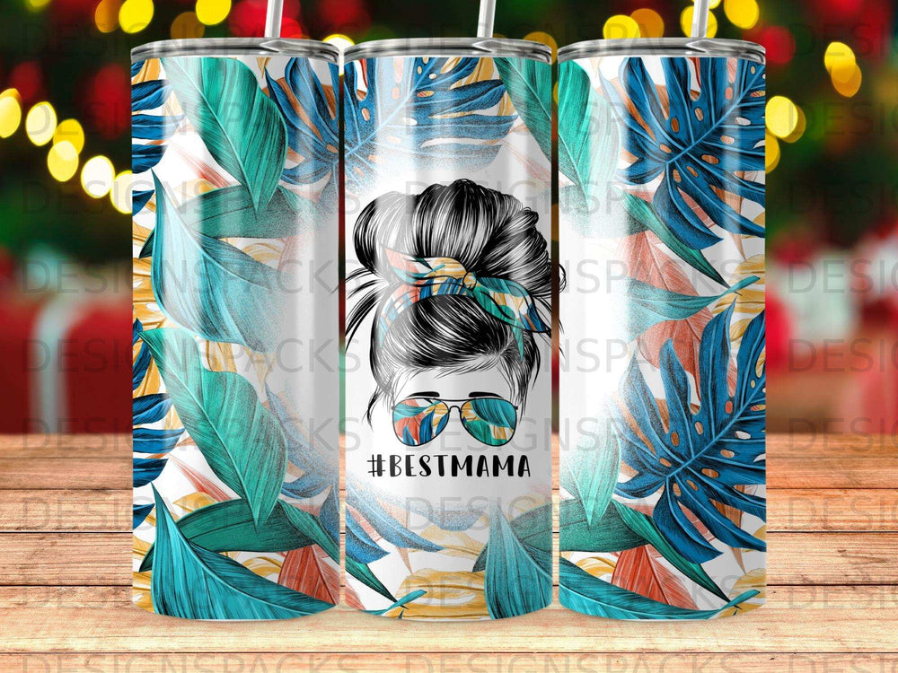 Tumbler with #BESTMAMA text and tropical leaf pattern.