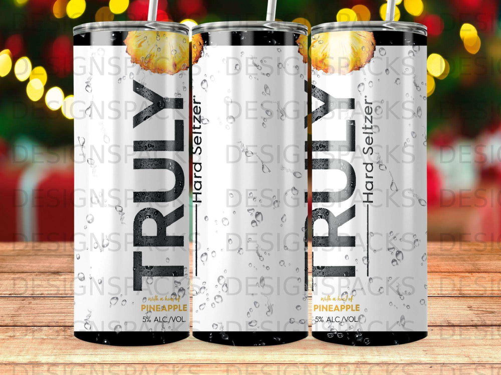 Three Trulys Hard Seltzer pineapple cans with condensation.