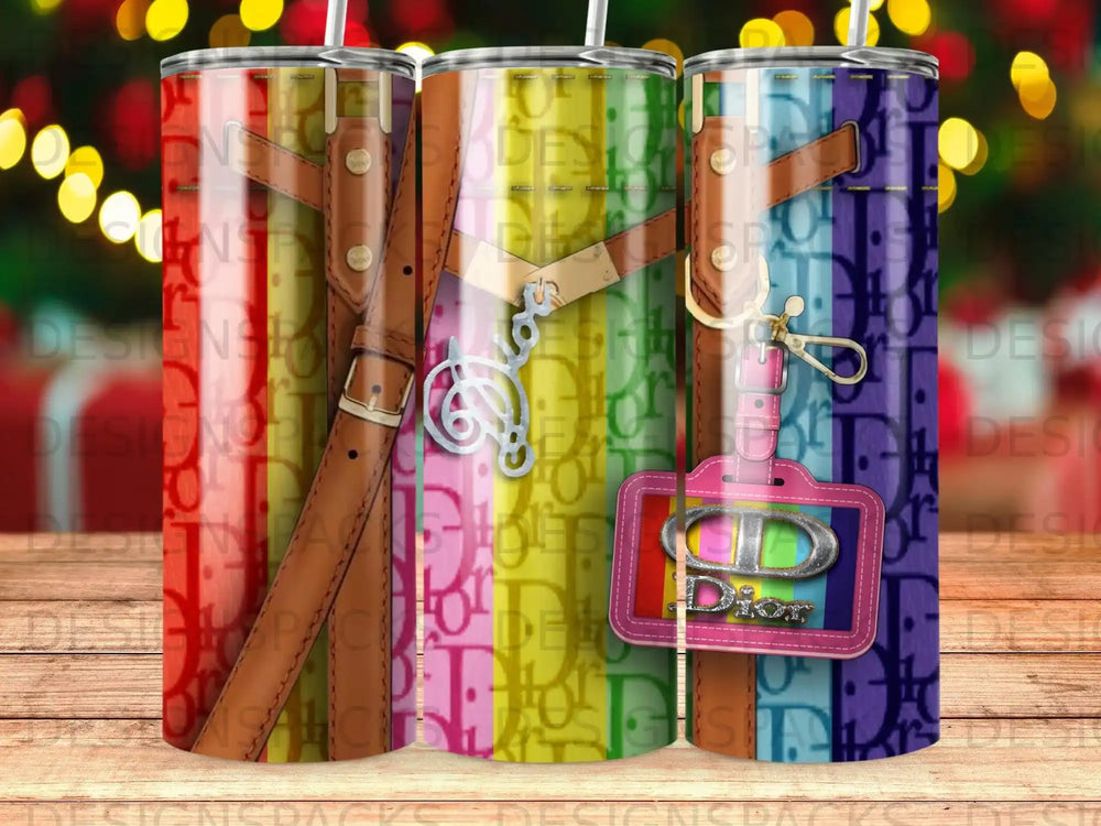 Three tumblers with a Dior pattern and colorful striped straps.