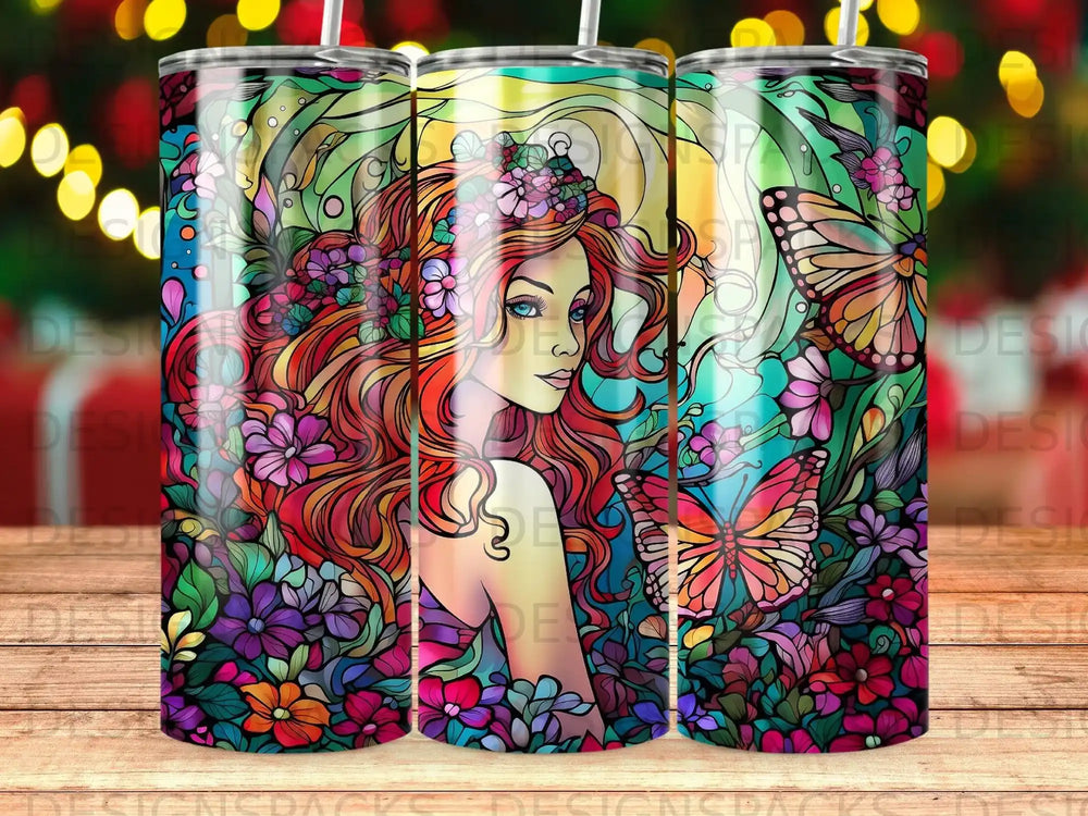 Woman with long red hair surrounded by colorful flowers and butterflies.